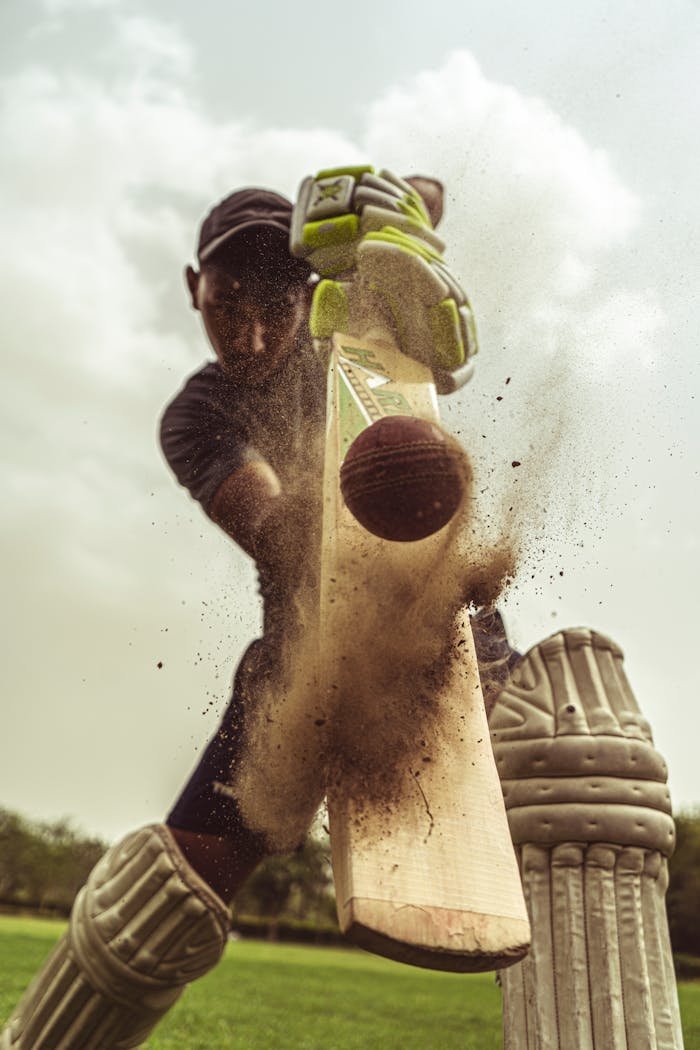 Low Angle Shot of Man Playing Cricket